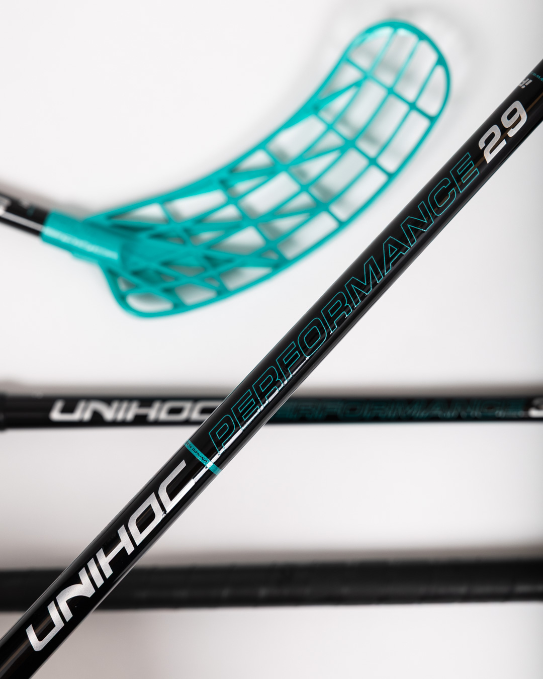 STICK UNILITE PERFORMANCE MID FL 29 BLACK/TURQ