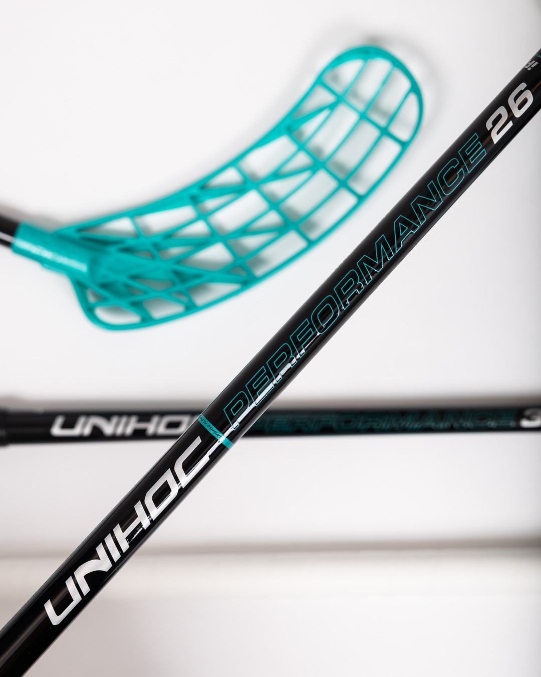 STICK UNILITE PERFORMANCE MID FL 26 BLACK/TURQ